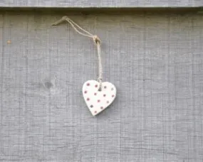 small cream wooden heart on string